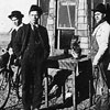 Louie Tonneson outside his homestead shack in the Lost Lake area of Alberta,two miles east of Enchant, Alberta. L-R: Martin Hobert, Harry Hobert, and Louie Tonneson, the owner.