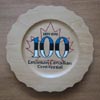 The centenary logo, designed by Janet Matiisen,Calgary, and burned into souvenir plate by Dave Kiil.