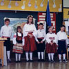 Five keen students, dressed in colourful Estonian folk costumes, ready to perform, 1991