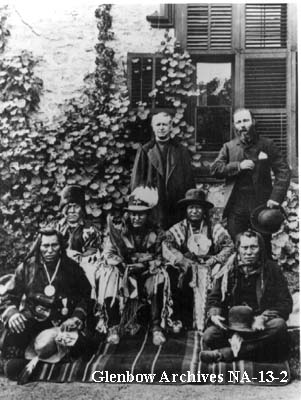 Blackfoot on visit to Ottawa, Ontario. 1886. L-R back row: Father Lacombe, Jean L'Heureux. L-R middle row: Three Bulls (Blackfoot), Crowfoot (Blackfoot), Red Crow (Blood). L-R front row: North Axe (North Peigan), One Spot (Blood). 