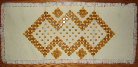 Coffee table cloth with Estonian patterns. Embroidered by Leena Kiil, 1970s.