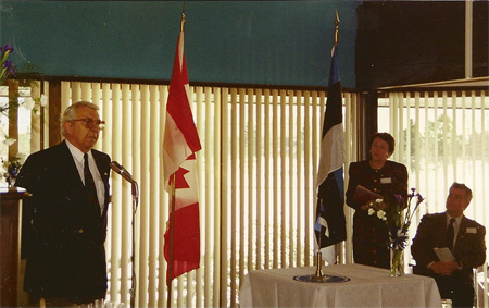  Zig Skribis, President of Edmonton Latvian Society, speaking at Independence Day ceremony