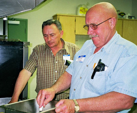 Allan Posti and August Liivam preparing pioneer breakfast at Gilby Centennial , 2001.  