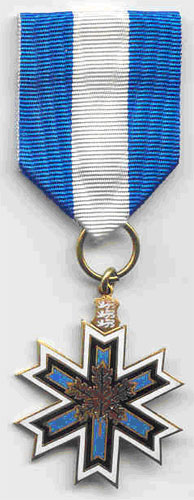 The Canadian-Estonian Award of Merit Medal presented to Eda McClung and Helgi Leesment at the Centennial Celebration at Barons on July 30, 2004.