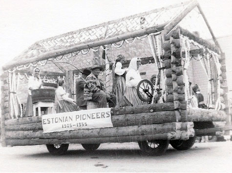 Estonian pioneers enter a float in a parade at Eckville to celebrate  Alberta\'s 50th anniversary as a province, 1905-1955