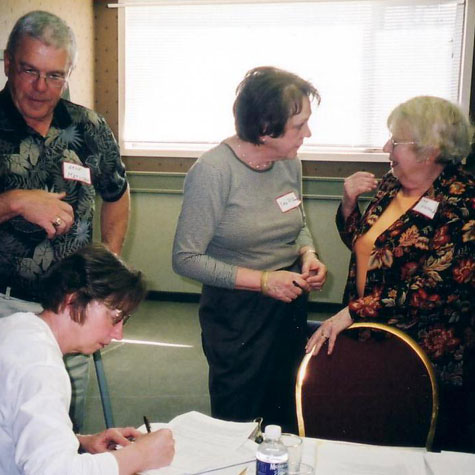 Helgi Leesment, Arne Matiisen, Eda McClung and Livia Kivisild at the signing ceremony in Red Deer, April, 2005