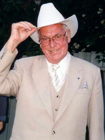 Estonian President Lennart Meri presented with a white Stetson upon his arrival in Calgary, 2000.
