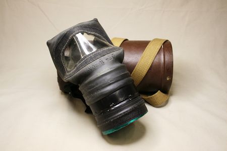 Gas Mask in a circular carrying case with shoulder strap
