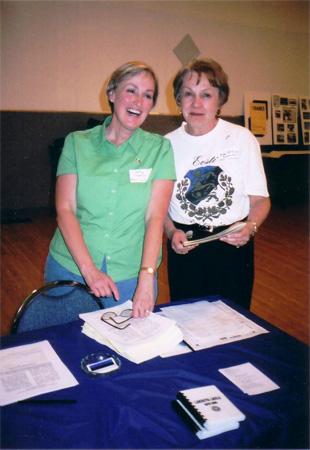 Kathy Tipman and Eda McClung enjoy a lighthearted moment welcoming attendees to Jaanipev gathering at Linda Hall, 2005