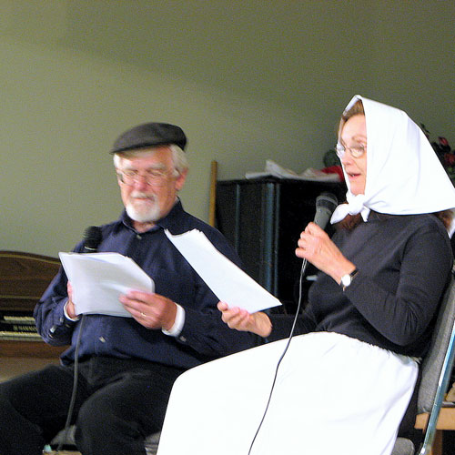 Dave Kiil,(Jakob), and Barbara Gullickson, (Mari), read the story of the Erdman family\'s journey from Estonia to Crimea, to South Dakota and, finally, to Barons, Alberta. The play was presented at the Jaanipev celebration,Lincoln Hall, 2007.