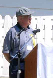 Peter Leesment, a member of the 2004 Barons Centennial  organizing committee, speaking during the opening ceremony.