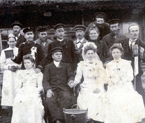 Wedding party on the island of Saaremaa preparing to toast the Bride and Groom, ca 1900