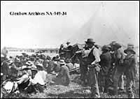The Honourable David Laird explaining the terms of Treaty #8, Fort Vermilion, Alberta. 1899.