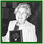 Majorie Ludvigsson presented with Life Membership from the Alix Chamber of Commerce from Gilbert Giem, Alix Community Hall, June 8, 1988