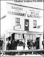 Bakery, restaurant, and Wong Yet Star laundry, 4907-5th Avenue, Olds, Alberta. 5th from left, Wong Pond. 2nd from right, Wong Yet, ca. 1904-1905.