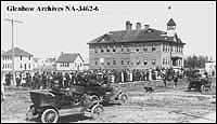Crowd listening to speaker beside high school in Camrose, Alberta, ca. 1912-1913.