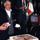 Elia Martina, first president of Fogolar Furlan, cutting cake at 25th anniversary of Fogolar Furlan, Calgary, Alberta, 1992.