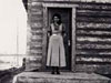 Mary Biollo standing in front of her first school - also first teacher in Christy Creek School district.(1934).  Photo courtesy of the Biollo-Doyle Family