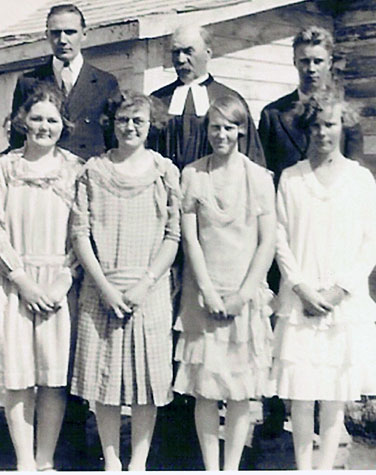 Rev. John Sillak is shown with Magda, Martha and Rosalinda Tihkane following their confirmation in Walsh, 1924