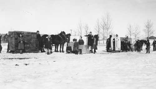 School children with horse drawn vehicles